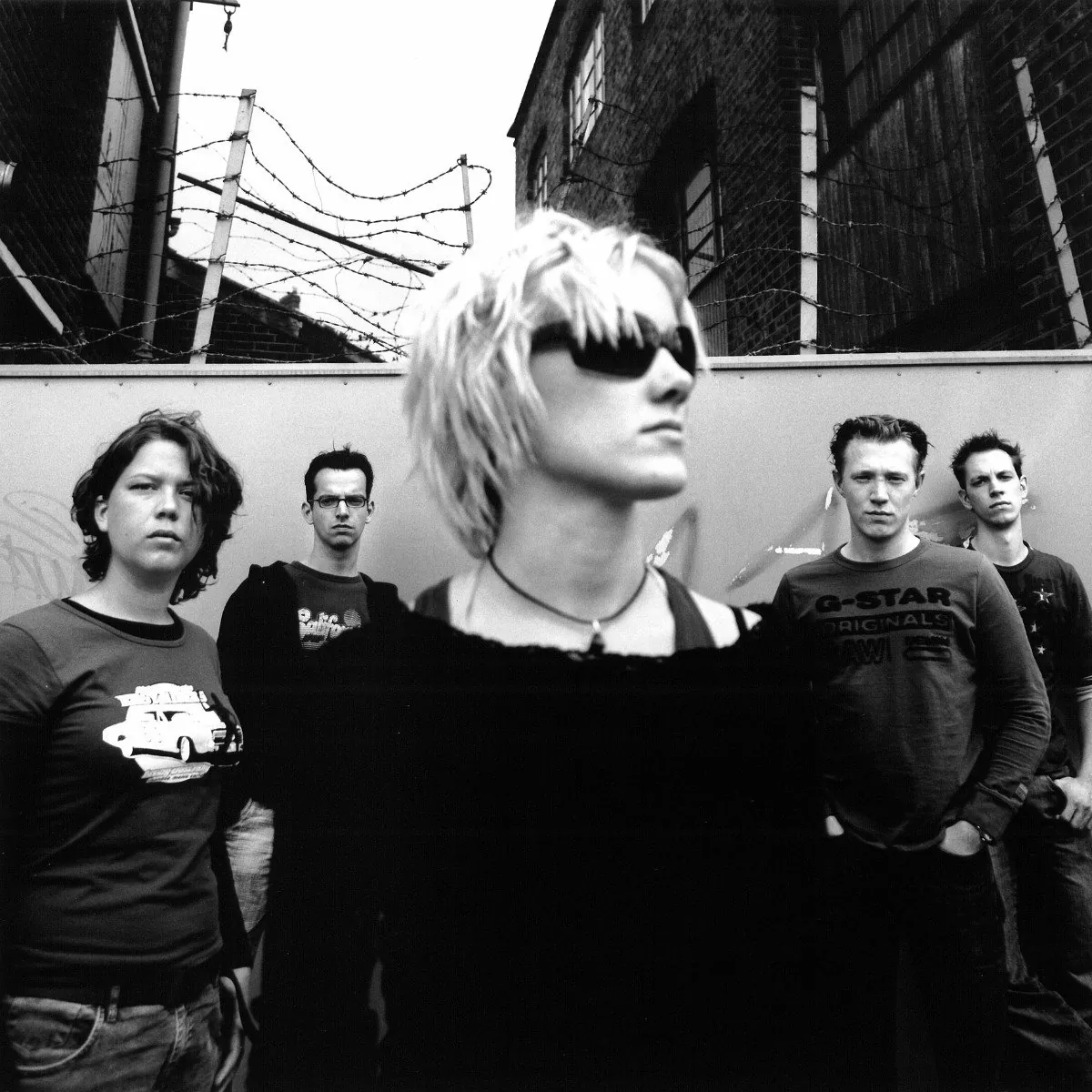 Black and white photo of the band Charing X